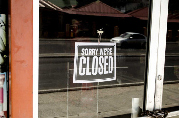 shutterstock_205488685.jpg featured image Closed sign hanging on a glass door