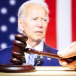 Joe Biden with a hand holding a gavel