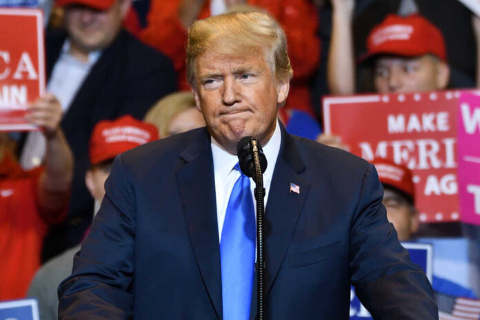 shutterstock_1515374468.jpg featured image Donald Trump at a rally with supporters.