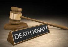 Gavel beside death penalty sign on desk