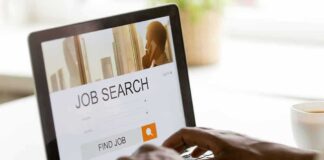 Person searching for jobs on a laptop.