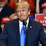 Donald Trump at a rally with supporters.