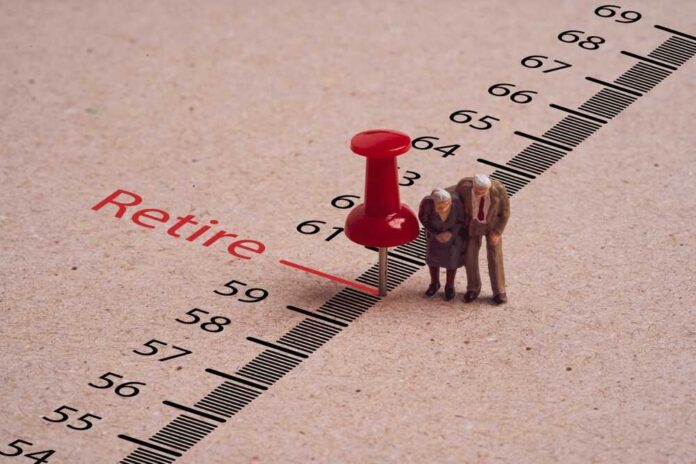 shutterstock_2501604659.jpg featured image Miniature elderly figures by retire pin marker