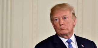 Donald Trump in suit and tie.