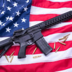 AR-15 Rifle and bullets on American flag background