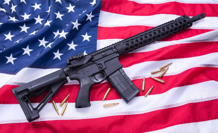 shutterstock_1086231845(1).jpg featured image AR-15 Rifle and bullets on American flag background