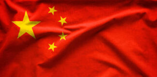 Chinese flag with five yellow stars.