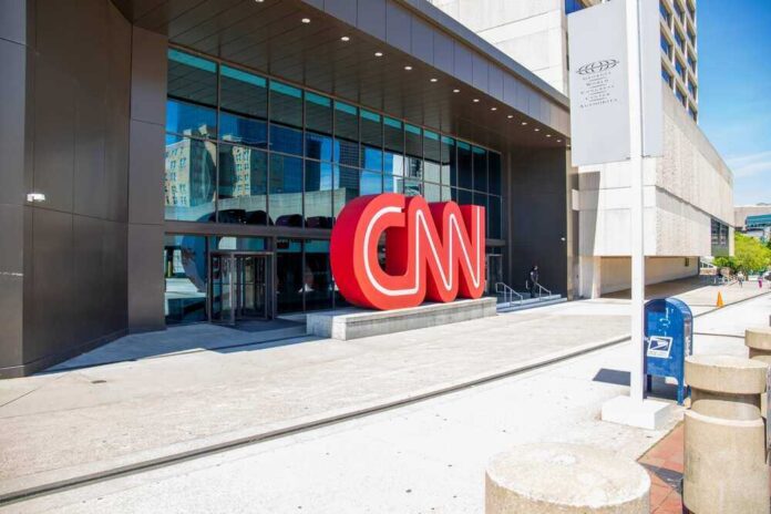 shutterstock_2288822533.jpg featured image CNN headquarters entrance with large red logo outside.