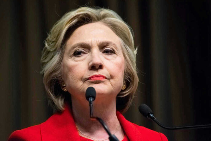 shutterstock452029942jpg Hillary Clinton behind microphones