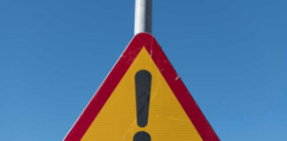 Triangular warning sign with exclamation mark