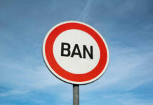 Sign reading BAN against blue sky background
