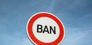 Sign reading BAN against blue sky background
