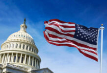 US Capitol building with American flag waving