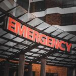 Illuminated emergency sign at a hospital entrance