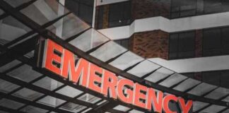 Illuminated emergency sign at a hospital entrance