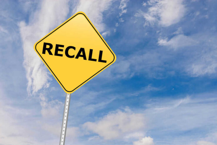 shutterstock_529192612.jpg Yellow sign with RECALL text against blue sky