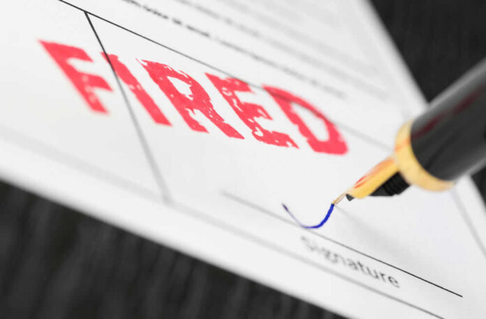 shutterstock_761289151.jpg Fountain pen signing document with the word fired