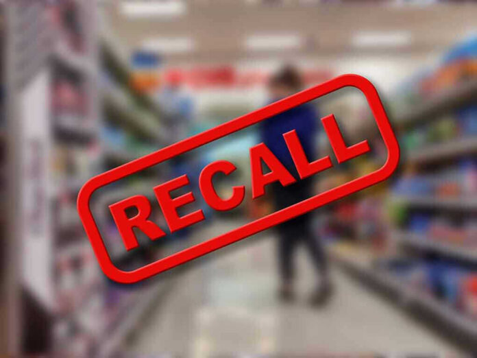 Recall stamp on blurred store aisle background