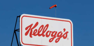 Kellogg's logo displayed on a large sign against a clear blue sky