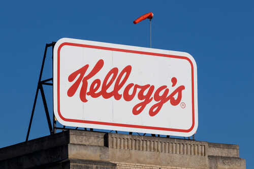 Kellogg's logo displayed on a large sign against a clear blue sky