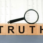 Prosecutors Buried THIS Truth for Three Decades?! Wooden blocks spelling truth with magnifying glass