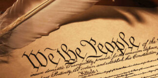 U.S. Constitution We the People with feather quill.
