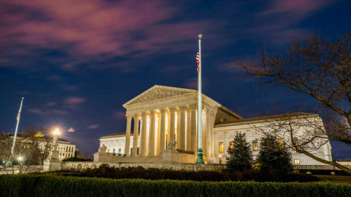 The United States Supreme Court building at dusk