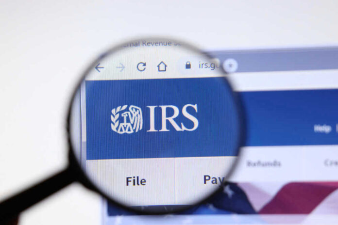 Magnifying glass focusing on IRS website logo