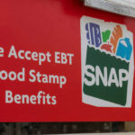 Red sign showing SNAP EBT food stamp benefits