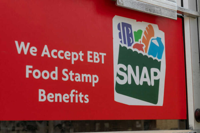 Red sign showing SNAP EBT food stamp benefits