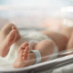 Baby Found Alone on Beach — Unbelievable Excuse Newborn baby in hospital bassinet with ID band.