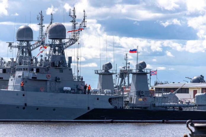 shutterstock_2180409489.jpg Russian military ships docked at harbor.