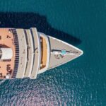 HORRIFYING Cruise Death — FBI Investigating Now Aerial view of a cruise ship's deck with sun loungers and a pool