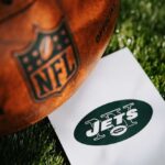 NY Jets Player GUNNED DOWN — Fighting for Life An NFL football next to a New York Jets logo on a white card