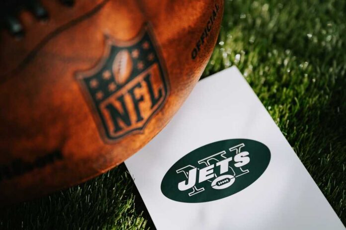 An NFL football next to a New York Jets logo on a white card