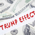 Text Trump Effect over hundred dollar bills