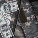 MASSIVE Military Bonus Nobody Saw Coming Cash placed inside a military uniform pocket