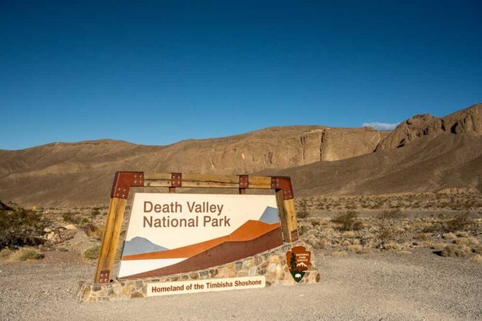 Sign for Death Valley National Park against a desert backdrop