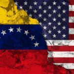 Cracked Venezuela and USA flags side by side
