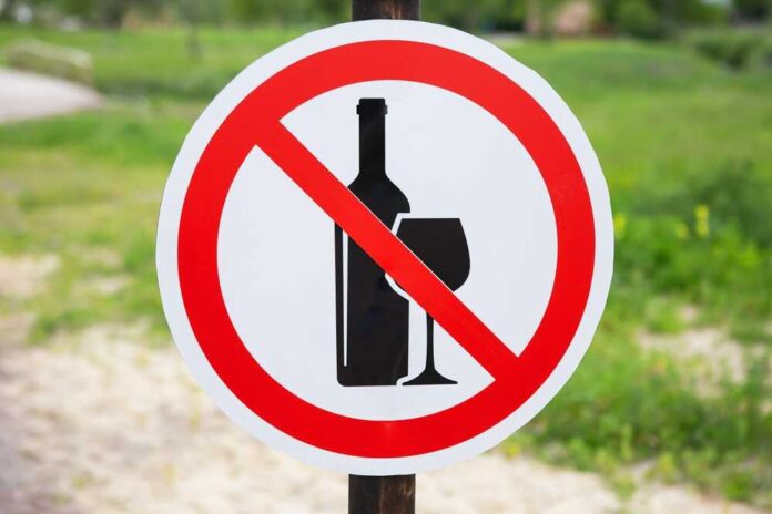 Sign indicating prohibition of alcohol with a bottle and glass symbol