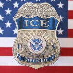 DEADLY Actions Trigger Sudden ICE Leadership Overhaul ICE officer badge displayed against an American flag background
