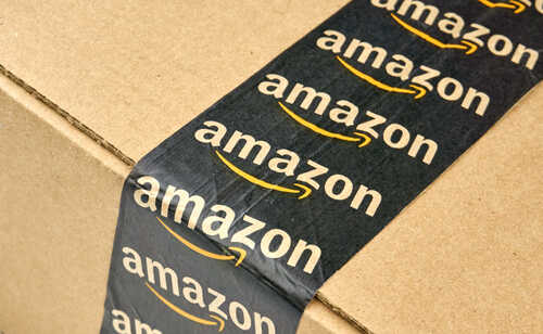 Close-up of an Amazon-branded shipping box tape on a cardboard box
