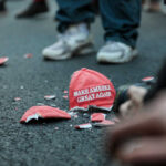 Shattered Make America Great Again hat on the ground