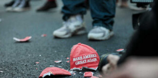 Shattered Make America Great Again hat on the ground