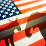 Commerce Chief LIED About Epstein — Bipartisan FURY Erupts Donkey and elephant silhouettes on American flag background.