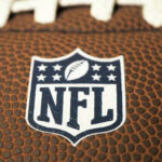 Close-up of NFL logo on American football.