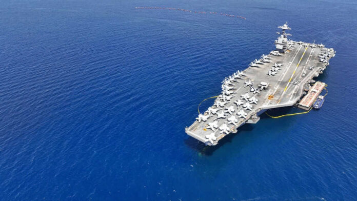Aircraft carrier on a vast blue ocean