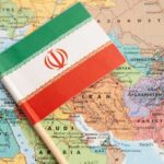 Iran WEAPONIZES Critical Oil Chokepoint Iranian flag placed on a map of the Middle East