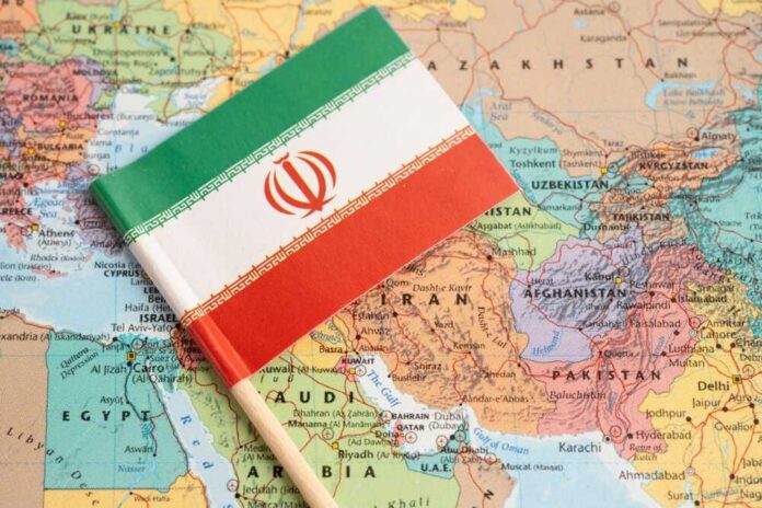 Iranian flag placed on a map of the Middle East