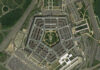 Pentagon Insider Trading Scandal Revealed? Aerial view of the Pentagon building surrounded by roads and parking lots
